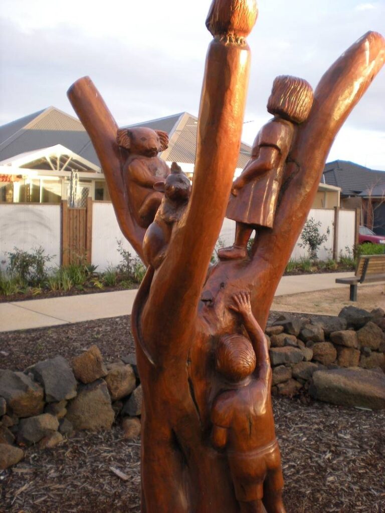 Native Life combining with settlement life in Caroline Springs area carved by John Brady using Chainsaws - view 1