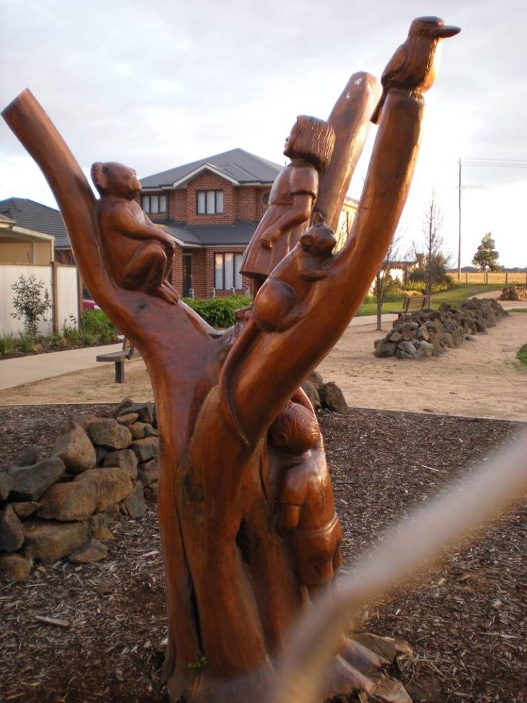 Native Life combining with settlement life in Caroline Springs area carved by John Brady using Chainsaws - view 2