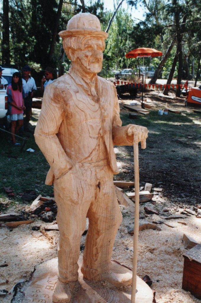 To win an Australian Chainsaw carving competition, John Brady carves  Charli Chaplin