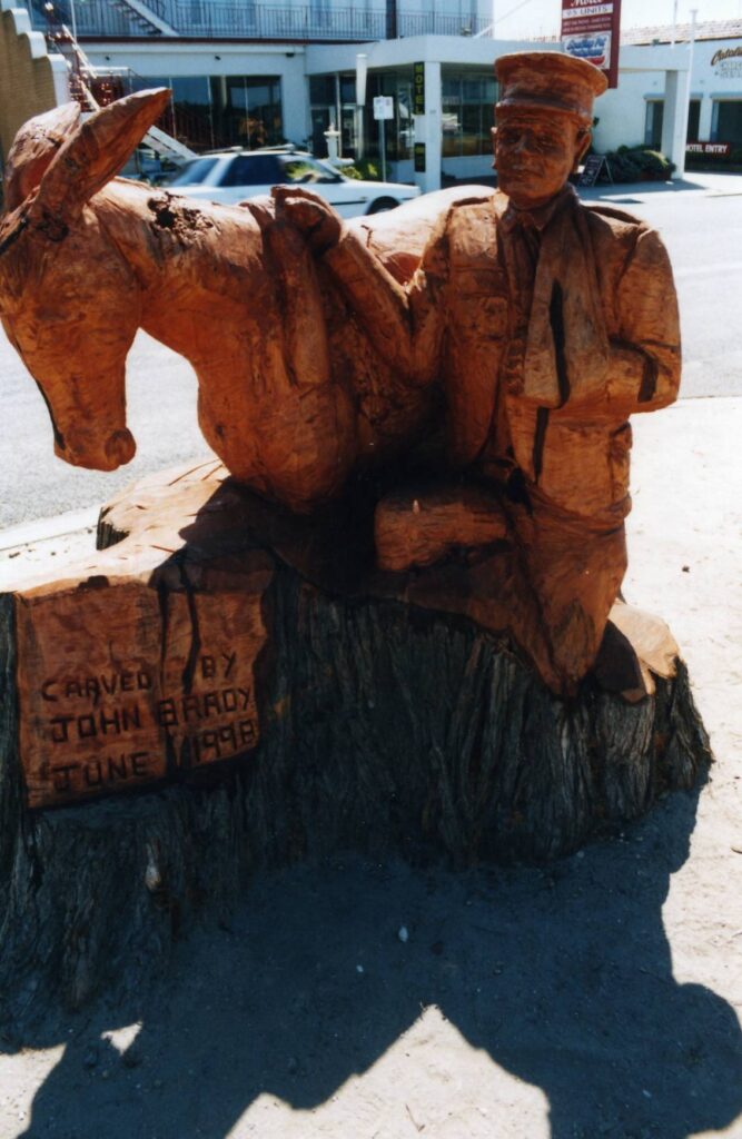 Chainsaw Carved Statue of a WW1 typical scene of donkeys serving in the war