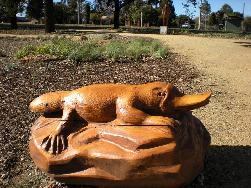 An oversize Platypus statue carved with a chainsaw by John Brady